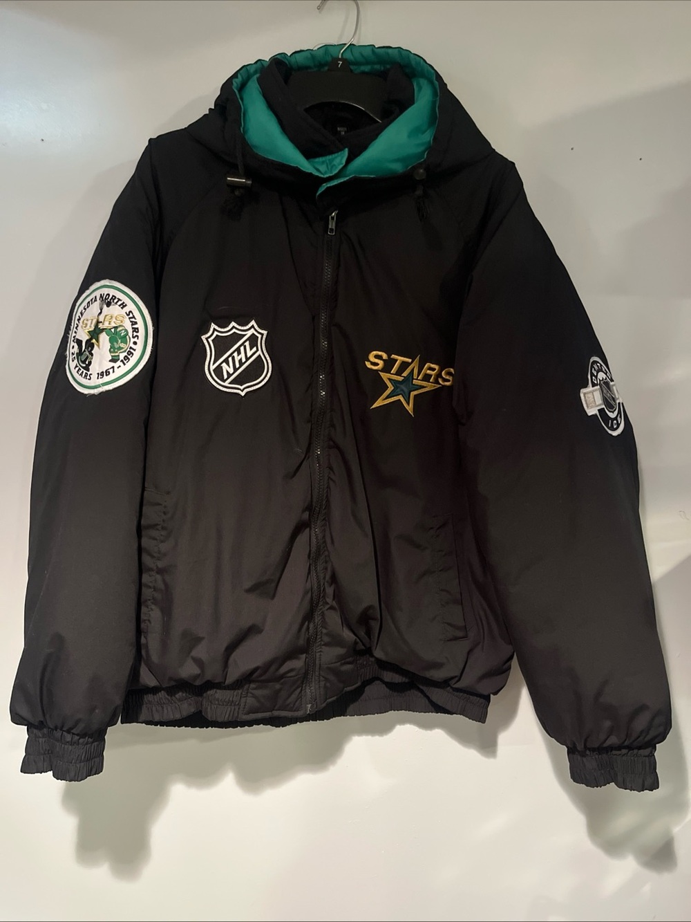 Youth Black Puffer Jacket with Teal Lining - Stars NHL Style